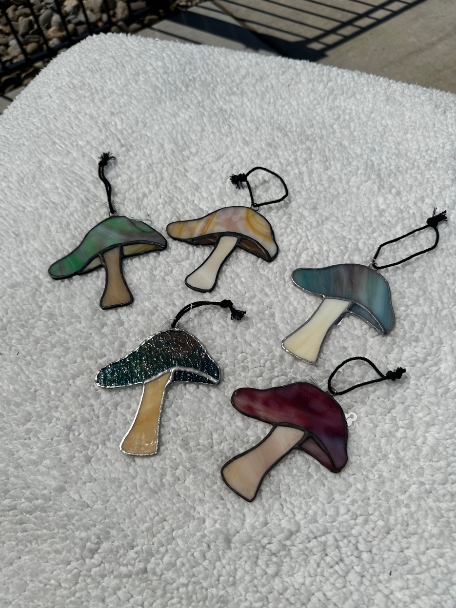 Set of five stained glass mushroom suncatchers in earth tones