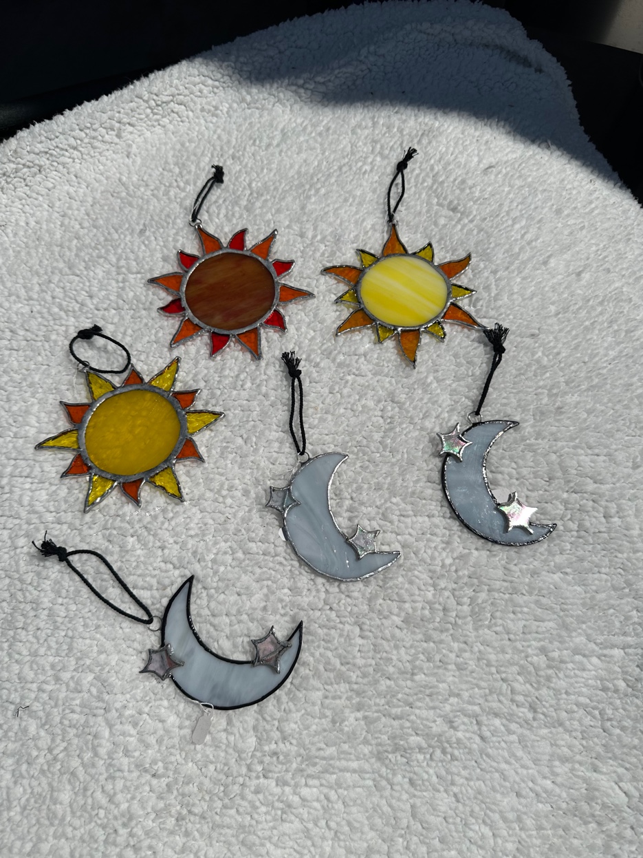 Stained glass suns and crescent moons with iridescent glass stars